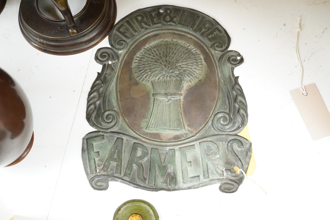 A collection of plaques to include a lead example and two copper examples one ‘Fire & Life, Farmers’, largest 30cm high